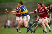 12 May 1996; Nicky English of Tipperary in action against Conor O'Donovan of Galway during the National Hurling League Final between Galway and Tipperary at the Gaelic Grounds in Limerick. Photo by Ray McManus/Sportsfile
