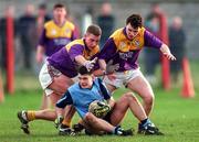 22 February 1997; Paul Croft of Dublin is tackled by Rory Stafford and Jason Lawlor of Wexford during Leinster Under-21 Football Championship match between Dublin and Wexford at Parnell Park in Dublin. Photo by Ray McManus/Sportsfile