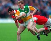 9 June 1996; Ronan Mooney of Offaly gets through the Louth defence during the Leinster Senior Football Championship Quarter-Final between Louth and Offaly at Pairc Tailteann in Navan. Photo by Pat Cashman/Sportsfile