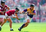 4 August 1996; Rory McCarthy of Wexford evades the tackles of Michael Donoghue, centre, and Joe Rabbitte of Galway during the All-Ireland Senior Hurling Championship Semi-Final between Wexford and Galway at Croke Park in Dublin. Photo by Ray McManus/Sportsfile