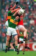 21 July 1996; Maurice Fitzgerald and Seamus Moynihan of Kerry battle for possession of a high ball against Liam Honan and Paul McGrath of Cork during the Munster Senior Football Championship Final at Pairc Ui Chaoimh in Cork. Photo by Ray McManus/Sportsfile