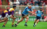 23 June 1996; Sean Deignan of Dublin evades the challenges of Sean Flood and Martin Storey of Wexford during the Leinster Senior Hurling Championship Semi-Final between Dublin and Wexford at Croke Park in Dublin. Photo by Brendan Moran/Sportsfile