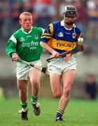 13 April 1997; Thomas Dunne of Tipperary in action against Dave Clarke of Limerick during the National Hurling League Division 1 match between Limerick v Tipperary at the Gaelic Grounds in Limerick. Photo by Brendan Moran/Sportsfile