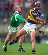 13 April 1997; Thomas Dunne of Tipperary in action against Dave Clarke of Limerick during the National Hurling League Division 1 match between Limerick v Tipperary at the Gaelic Grounds in Limerick. Photo by Brendan Moran/Sportsfile
