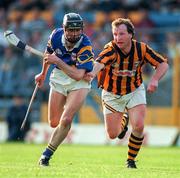 31 May 1997; Tommy Dunne of Tipperary races clear from Eddie O'Connor of Kilkenny during the National Hurling League Division 1 match between Tipperary and Kilkenny in Semple Stadium in Thurles, Co Tipperary. Photo by Ray McManus/Sportsfile