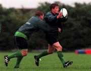 27 September 1999: Brian O'Driscoll is tackled by Paul Wallace during an Ireland Rugby training session at Garda Club Westmanstown in Lucan, Dublin. Photo by Matt Browne/Sportsfile