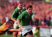 10 October 1999; Brian O'Driscoll of Ireland in action against Ben Tune of Australia during the Rugby World Cup Pool E match between Ireland and Australia at Lansdowne Road in Dublin. Photo by Matt Browne/Sportsfile