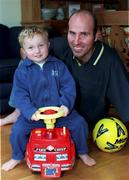 1 October 1999; Dublin footballer Brian Stynes with his two-year-old son Jamie relax at their home in Dublin. Photo by David Maher/Sportsfile