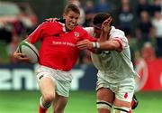 4 September 1999; Colm McMahon of Munster is tackled by Dion O'Cuinneagain of Ulster during the Guinness Interprovincial Championship match between Ulster and Munster at Queens University in Belfast. Photo by Matt Browne/Sportsfile