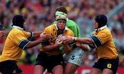 10 October 1999; David Giffin of Australia is tackled by Malcolm O'Kelly of Ireland during the Rugby World Cup Pool E match between Ireland and Australia at Lansdowne Road in Dublin. Photo by Brendan Moran/Sportsfile