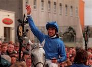 11 September 1999; Jockey Frankie Dettori, onboard Daylami, acknowledges the crowd after winning the Esat Digifone Champion Stakes at Leopardstown Racecourse in Dublin. Photo by Damien Eagers/Sportsfile