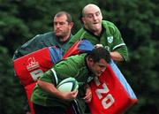 27 September 1999: Dion O'Cuinneagain is blocked by Keith Wood and Peter Clohessy, left, during an Ireland Rugby training session at Garda Club Westmanstown in Lucan, Dublin. Photo by Matt Browne/Sportsfile