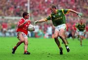 26 September 1999; Don Davis of Cork in action against John McDermott of Meath during the Bank of Ireland All-Ireland Senior Football Championship Final match between Meath and Cork at Croke Park in Dublin. Photo by Matt Browne/Sportsfile