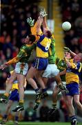 31 October 1999; Donal O'Sullivan, 8, of Clare, goes up for the ball against David Gallagher, left, and Nigel Nestor of Meath during the Church & General National Football League Division 1B match between Meath and Clare at Páirc Tailteann in Navan, Meath. Photo by Ray McManus/Sportsfile