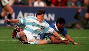 24 October 1999; France's Emile N'Tamack scores his side's third try despite the attention of Ignacio Corleto of Argentina during the Rugby World Cup Quarter-Final match between France and Argentina at Lansdowne Road in Dublin. Photo by Brendan Moran/Sportsfile