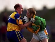 31 October 1999; Graham Geraghty of Meath is tackled by Donal O'Sullivan of Clare during the Church & General National Football League Division 1B match between Meath and Clare at Páirc Tailteann in Navan, Meath. Photo by Ray McManus/Sportsfile
