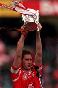 12 September 1999; Cork captain Mark Landers lifts the Liam MacCarthy Cup following the Guinness All-Ireland Senior Hurling Championship Final between Cork and Kilkenny at Croke Park in Dublin. Photo by Brendan Moran/Sportsfile