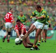 26 September 1999; John McDermott of Meath in action against Don Davis of Cork during the Bank of Ireland All-Ireland Senior Football Championship Final match between Meath and Cork at Croke Park in Dublin. Photo by Brendan Moran/Sportsfile