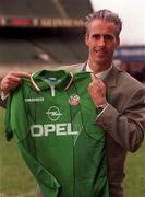 5 February 1996; Newly appointed Republic of Ireland manager Mick McCarthy poses with a Republic of Ireland jersey at Lansdowne Road in Dublin. Photo by David Maher/Sportsfile