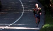 7 October 1997; Republic of Ireland manager Mick McCarthy takes an early morning walk to a training session at the AUL Grounds in Clonshaugh, Dublin. Photo by Brendan Moran/Sportsfile