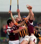 19 September 1999; Aidan Cummins of Kilkenny in action against Eamon Donoghue, left, and Shane Lawless of Galway during the All-Ireland U21 Hurling Championship Final between Kilkenny and Galway at O'Connor Park in Tullamore, Offaly. Photo by Brendan Moran/Sportsfile