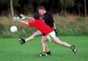 16 September 1999; Mark O'Reilly attempts to block down the kick of Trevor Giles during a training session, in Dalgan Park, Navan, Meath, ahead of the Bank of Ireland All-Ireland Senior Football Championship Final. Photo by Brendan Moran/Sportsfile
