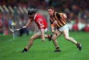 12 September 1999; Wayne Sherlock of Cork in action against Charlie Carter of Kilkenny during the Guinness All-Ireland Senior Hurling Championship Final between Cork and Kilkenny at Croke Park in Dublin. Photo by Damien Eagers/Sportsfile