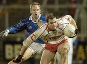 20 January 2007; Paul Rouse, Tyrone, in action against Anthony Forde, Cavan. Gaelic Life Dr. McKenna Cup, Section B, 3rd Round, Cavan v Tyrone, Kingspan Breffni Park, Co. Cavan. Photo by Sportsfile