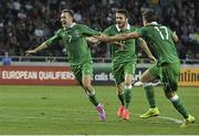 7 September 2014; Aiden McGeady, left, Republic of Ireland, celebrates after scoring his side's second and winning goal with team-mate's Robbie Brady and Stephen Ward. UEFA EURO 2016 Championship Qualifer, Group D, Georgia v Republic of Ireland. Boris Paichadze National Arena, Tbilisi, Georgia. Picture credit: David Maher / SPORTSFILE