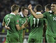 7 September 2014; Aiden McGeady, second from left, Republic of Ireland, celebrates after scoring his side's second and winning goal with team-mate's Seamus Coleman, Robbie Brady and Jonathan Walters. UEFA EURO 2016 Championship Qualifer, Group D, Georgia v Republic of Ireland. Boris Paichadze National Arena, Tbilisi, Georgia. Picture credit: David Maher / SPORTSFILE