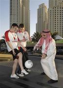 24 January 2007; Ross Munnelly, Laois, left, and Brian Kavangh, Longford, demonstrate Gaelic Football to Ahmed Atiya, an employee of the Royal Meridien Hotel. Royal Meridien Hotel, Dubai, United Arab Emirates. Picture credit: Ray McManus / SPORTSFILE