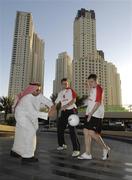 24 January 2007; Ross Munnelly, Laois, right, and Brian Kavangh, Longford, demonstrate Gaelic Football to Ahmed Atiya, an employee of the Royal Meridien Hotel. Royal Meridien Hotel, Dubai, United Arab Emirates. Picture credit: Ray McManus / SPORTSFILE