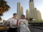 24 January 2007; Brian Kavanagh, Longford, demonstrates a 'fair shoulder' in Gaelic Football to Ahmed Atiya, an employee of the Royal Meridien Hotel. Dubai, United Arab Emirates. Picture credit: Ray McManus / SPORTSFILE