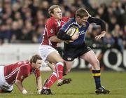 26 January 2007; Mick Berne, Leinster, is tackled by Ceiron Thomas and Darren Daniel, left, Llanelli Scarlets. Magners League, Leinster v Llanelli Scarlets, Donnybrook, Dublin. Picture credit: Pat Murphy / SPORTSFILE