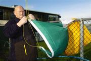 28 January 2007; Tom O'Connor, a volunteer worker at the Emerald Gaelic Grounds, prepares the tri-colour before the game. AIB All-Ireland Senior Club Football Championship Quarter Final, St. Brendan's v Dr. Crokes, Emerald Gaelic Grounds, Ruislip, London, England. Picture Credit: Pat Murphy / SPORTSFILE
