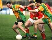 28 January 2007; Brendan Devenny and Rory Kavanagh, Donegal, in action against Enda McNulty, Armagh. McKenna Cup Semi Final, Armagh v Donegal, Healy Park, Omagh, Co. Tyrone. Picture Credit: Oliver McVeigh / SPORTSFILE