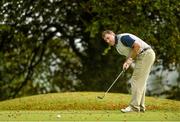 12 September 2014; Offaly hurling manager Brian Whelahan, representing Coolderry GAA Club, watches his putt on the 11th green during the 15th Annual All-Ireland GAA Golf Challenge. Waterford Castle Golf Club, Waterford. Picture credit: Matt Browne / SPORTSFILE