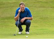 12 September 2014; Mattie Kenny, former Galway selector, representing Loughrea GAA Club, lines up his putt on the 7th green during the 15th Annual All-Ireland GAA Golf Challenge. Waterford Castle Golf Club, Waterford. Picture credit: Matt Browne / SPORTSFILE