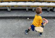 13 September 2014; Five year old Clare supporter Caoimhin Shannon, from Ennistymon, practices his hurling skills before the game. Bord Gáis Energy GAA Hurling Under 21 All-Ireland 'A' Championship Final, Clare v Wexford. Semple Stadium, Thurles, Co. Tipperary. Picture credit: Ray McManus / SPORTSFILE