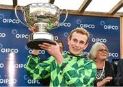 13 September 2014; Jockey Ryan Moore with the trophy after winning the QIPCO Irish Champion Stakes on The Grey Gatsby. Leopardstown Racecourse, Leopardstown, Co. Dublin. Picture credit: Matt Browne / SPORTSFILE