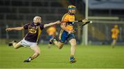 13 September 2014; Wexford substitute David Dunne knocks the sliothar off the stick Clare's Seadna Morey. Bord Gáis Energy GAA Hurling Under 21 All-Ireland 'A' Championship Final, Clare v Wexford. Semple Stadium, Thurles, Co. Tipperary. Picture credit: Ray McManus / SPORTSFILE