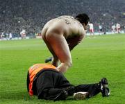 3 February 2007; A steward grapples with a streaker during the game. Allianz NFL Division 1A, Dublin v Tyrone, Croke Park, Dublin. Picture credit: Oliver McVeigh / SPORTSFILE