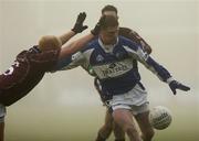4 February 2007; Brian McDonald, Laois, in action against Donal O'Donoghue, Westmeath. Allianz NFL, Division 1B, Westmeath v Laois, Cusack Park, Mullingar, Co. Westmeath. Picture credit: Brian Lawless / SPORTSFILE