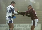 4 February 2007; Westmeath's Alan Mangan helps Laois goalkeeper Fergal Byron remove his gloves after the match. Allianz NFL, Division 1B, Westmeath v Laois, Cusack Park, Mullingar, Co. Westmeath. Picture credit: Caroline Quinn / SPORTSFILE