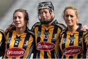 14 September 2014; Kilkenny players, from left, Edel Frisby, Mags Fennelly and Aisling Butler look on as Limerick lift the cup after the game. All Ireland Intermediate Camogie Championship Final, Kilkenny v Limerick, Croke Park, Dublin. Picture credit: Ramsey Cardy / SPORTSFILE