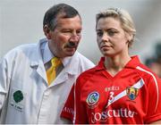14 September 2014; Umpire Mark Dunne, from the Moyne Templetuohy GAA club, Co. Tipperary, speaks with Cork captain Anna Geary before the game. Liberty Insurance All Ireland Senior Camogie Championship Final, Kilkenny v Cork, Croke Park, Dublin. Picture credit: Ramsey Cardy / SPORTSFILE