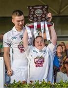 13 September 2014; Jennifer Malone, from Clane, and Kildare captain Gerry Keegan lift the trophy. Bord Gáis Energy GAA Hurling Under 21 All-Ireland 'B' Championship Final, Roscommon v Kildare. Semple Stadium, Thurles, Co. Tipperary. Picture credit: Ray McManus / SPORTSFILE