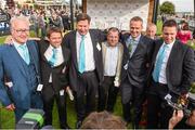 14 September 2014; Winning owner Michael Owen, second from left, and former Liverpool footballer Dietmar Hamann, second from right, with members of &quot;A Black and Owen Promotion&quot; after Brown Panther, with Richard Kingscote up, won the Palmerstown House Estate Irish St. Leger. Curragh Racecourse, The Curragh, Co. Kildare. Picture credit: Pat Murphy / SPORTSFILE