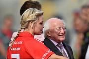 14 September 2014; President of Ireland Michael D. Higgins is introduced to the Cork team by captain Anna Geary. Liberty Insurance All Ireland Senior Camogie Championship Final, Kilkenny v Cork, Croke Park, Dublin. Picture credit: Ramsey Cardy / SPORTSFILE