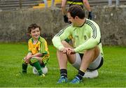 15 September 2014; Donegal's Michael Murphy with Mark McGuinness, son of team manager Jim McGuinness, during a squad training and press day ahead of the All-Ireland Senior Football Final. MacCumhaill Park, Ballybofey, Co. Donegal. Picture credit: Oliver McVeigh / SPORTSFILE
